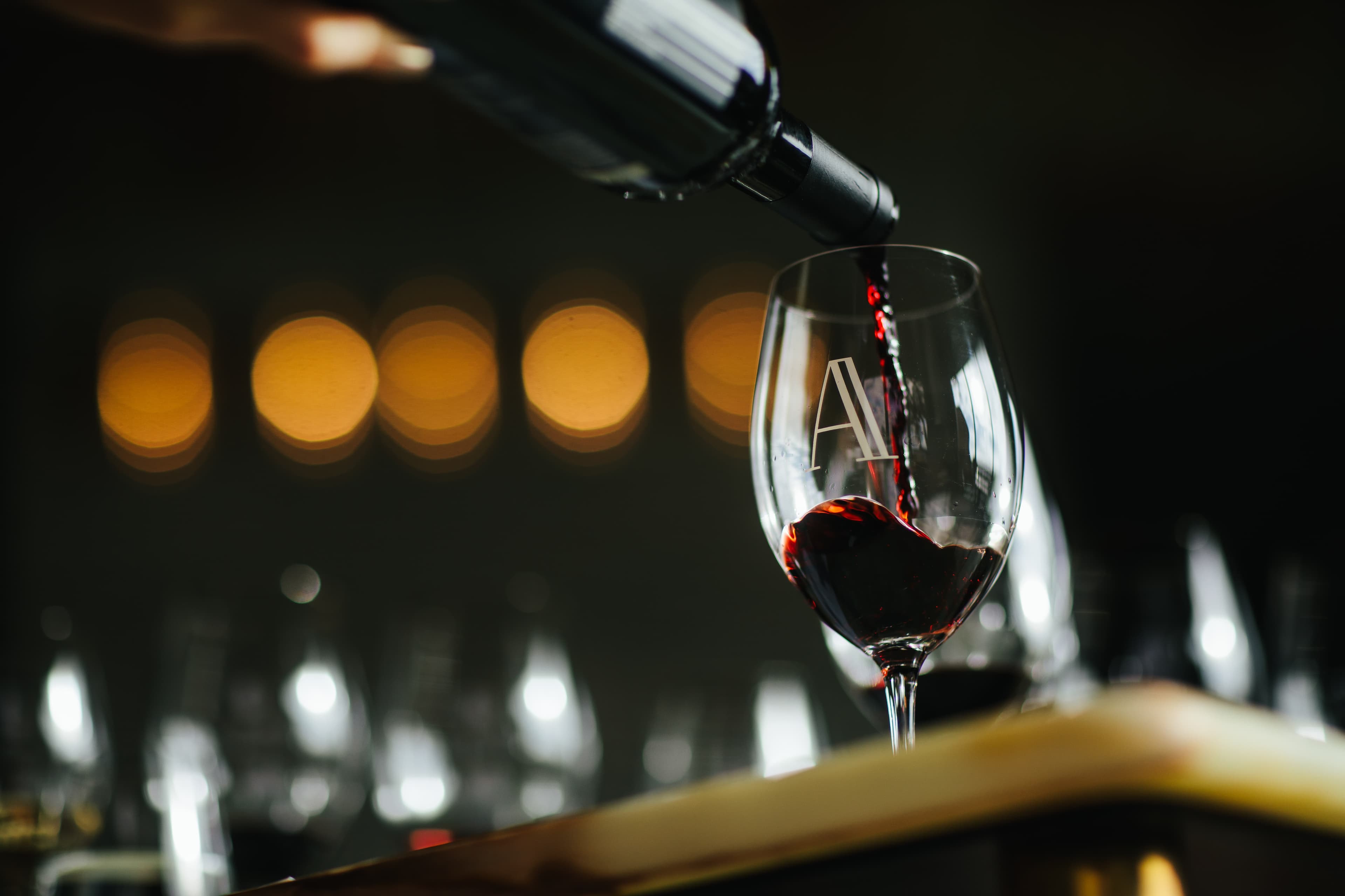 Domaine A red wine being poured into a glass